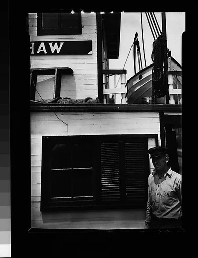 [Seaman Posing Next to Ship's Cabin Façade: "RUTH SHAW"]