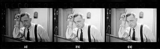 [4 Portraits of Walker Evans Seated at Desk]
