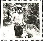 [Walker Evans Standing Before Wooded Path]