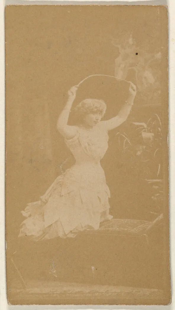 Actress holding riding crop above head, from the Actresses series (N668) — Unknown