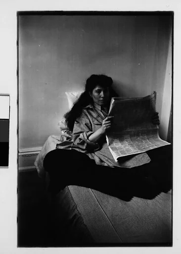 [Five 35mm Film Frames: Jane Smith Evans Reading Newspaper in Bed, New York City]