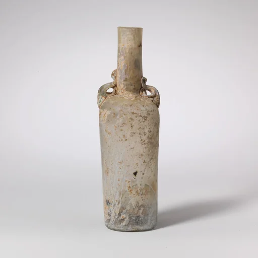Glass bottle with dolphin handles