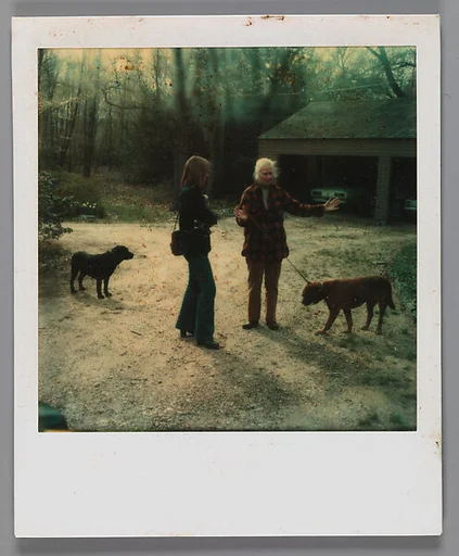 [Mary Knollenberg, Dogs, and Unidentified Woman in Driveway]