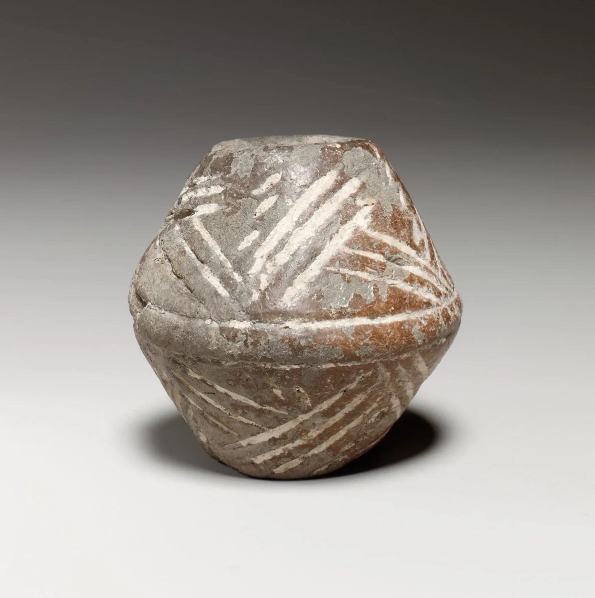 Terracotta biconical spindle-whorl with flat top — Unknown