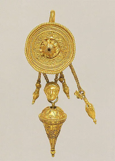 Gold disk earring with a female head and cone pendants — Unknown