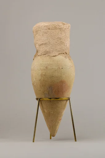 Jar with pointed base and intact seal