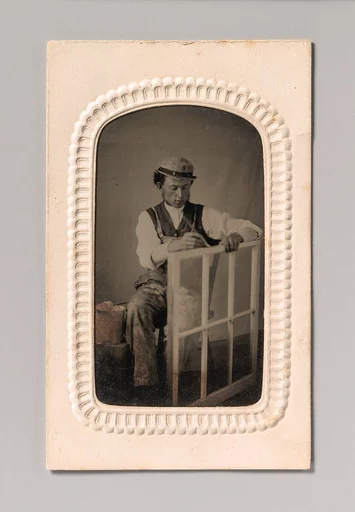 [Young Man Painting Window Frame]