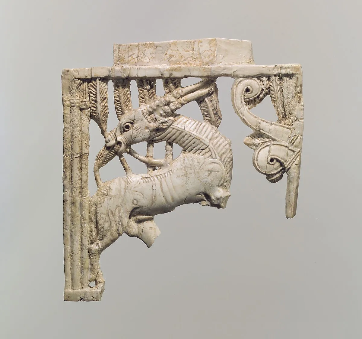 Openwork furniture plaque with a grazing oryx in a forest of fronds — Unknown