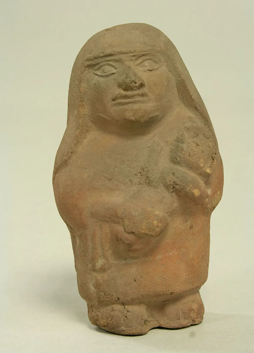 Standing Ceramic Figure with Child — Unknown