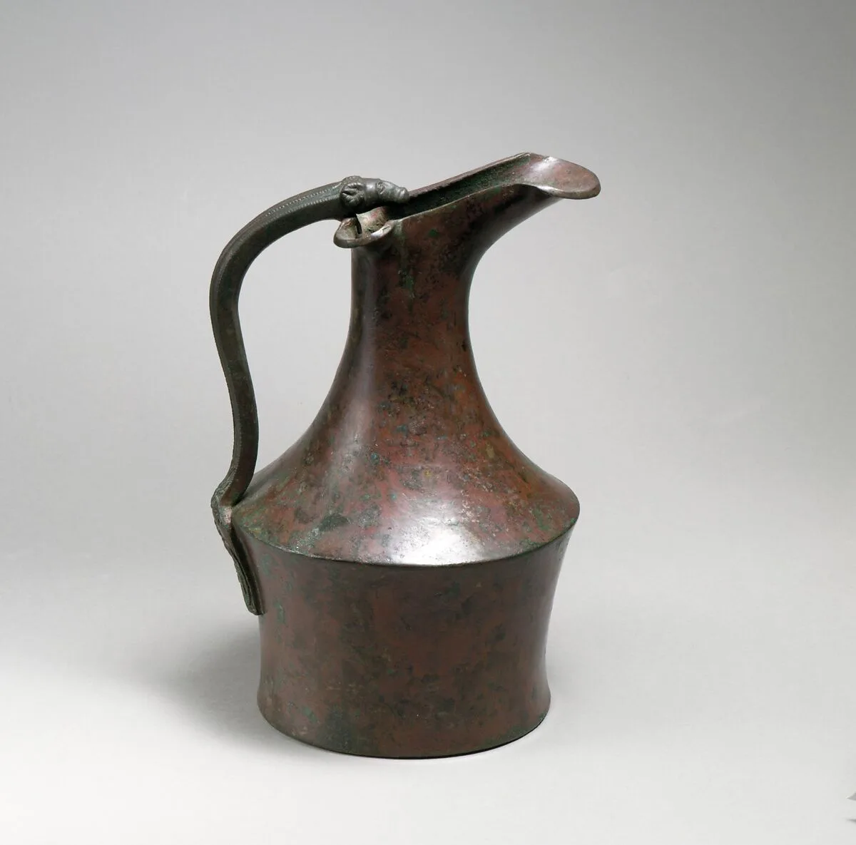 Bronze oinochoe (jug) and handle attachment — Unknown