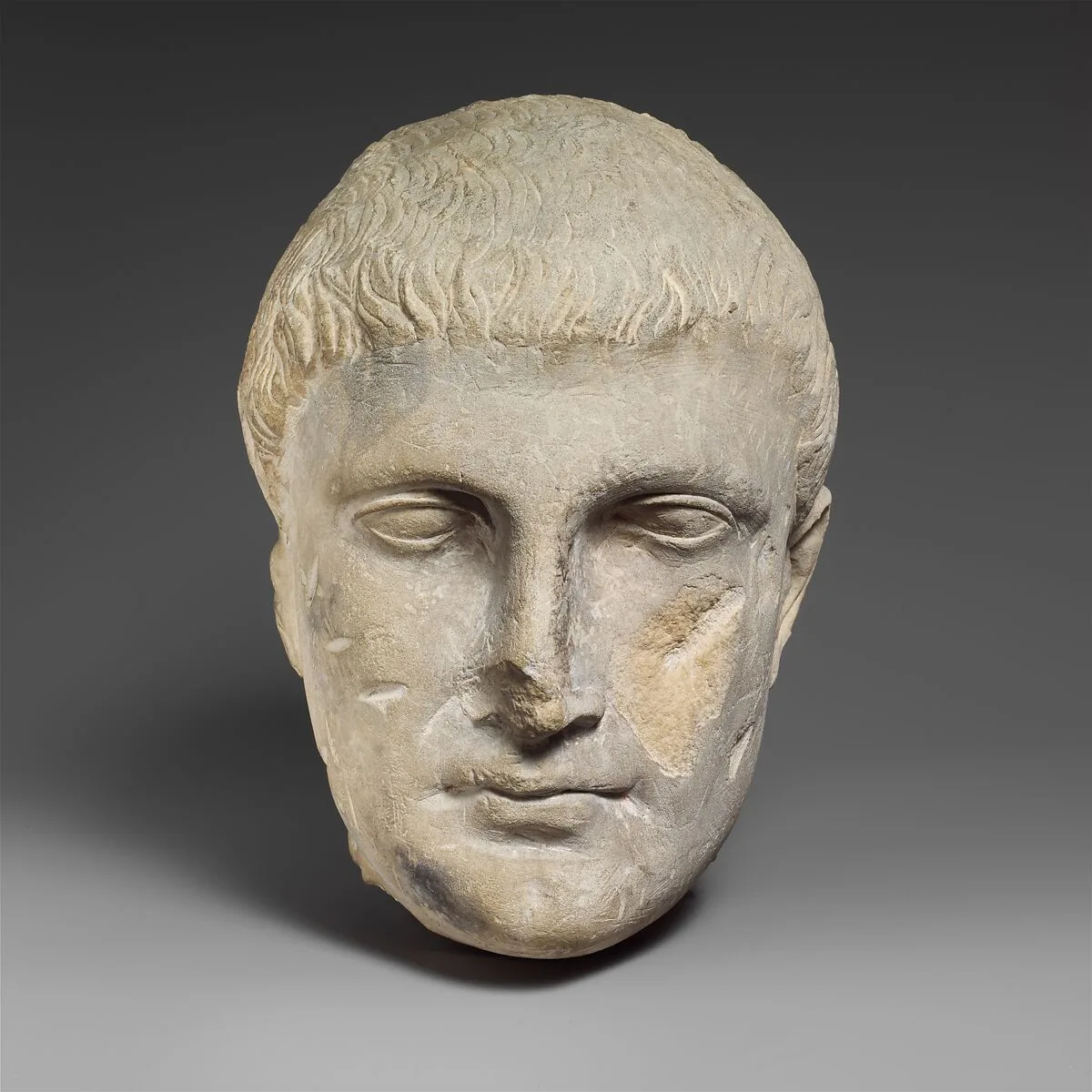 Limestone male head — Unknown