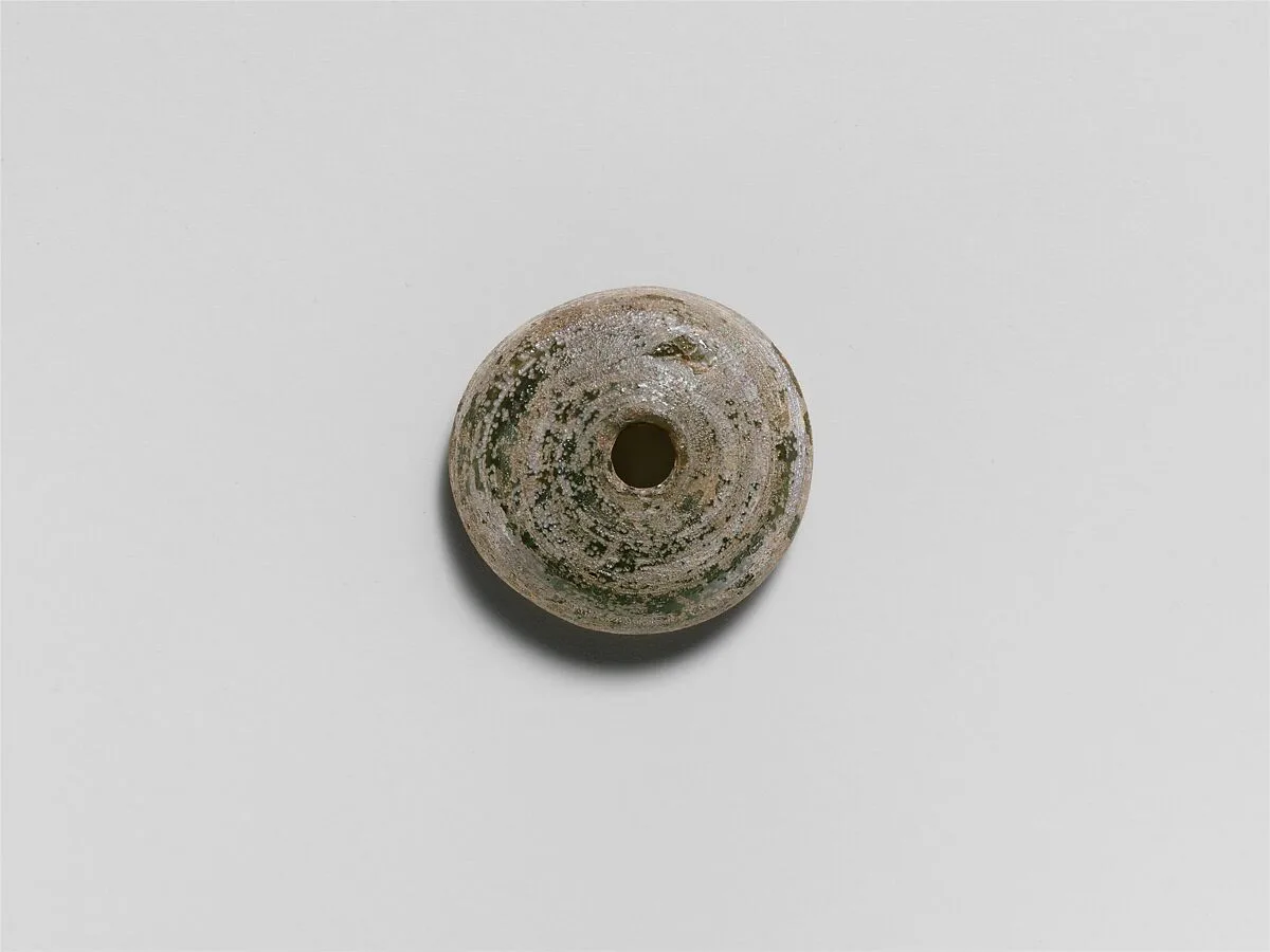 Glass spindle whorl — Unknown