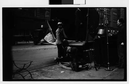 [Open Cab of Moving Truck on Street with Mirror, Hobby Horse, and Man in Foreground, New York City]