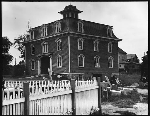 [House with Mansard Roof and Picket Fence]