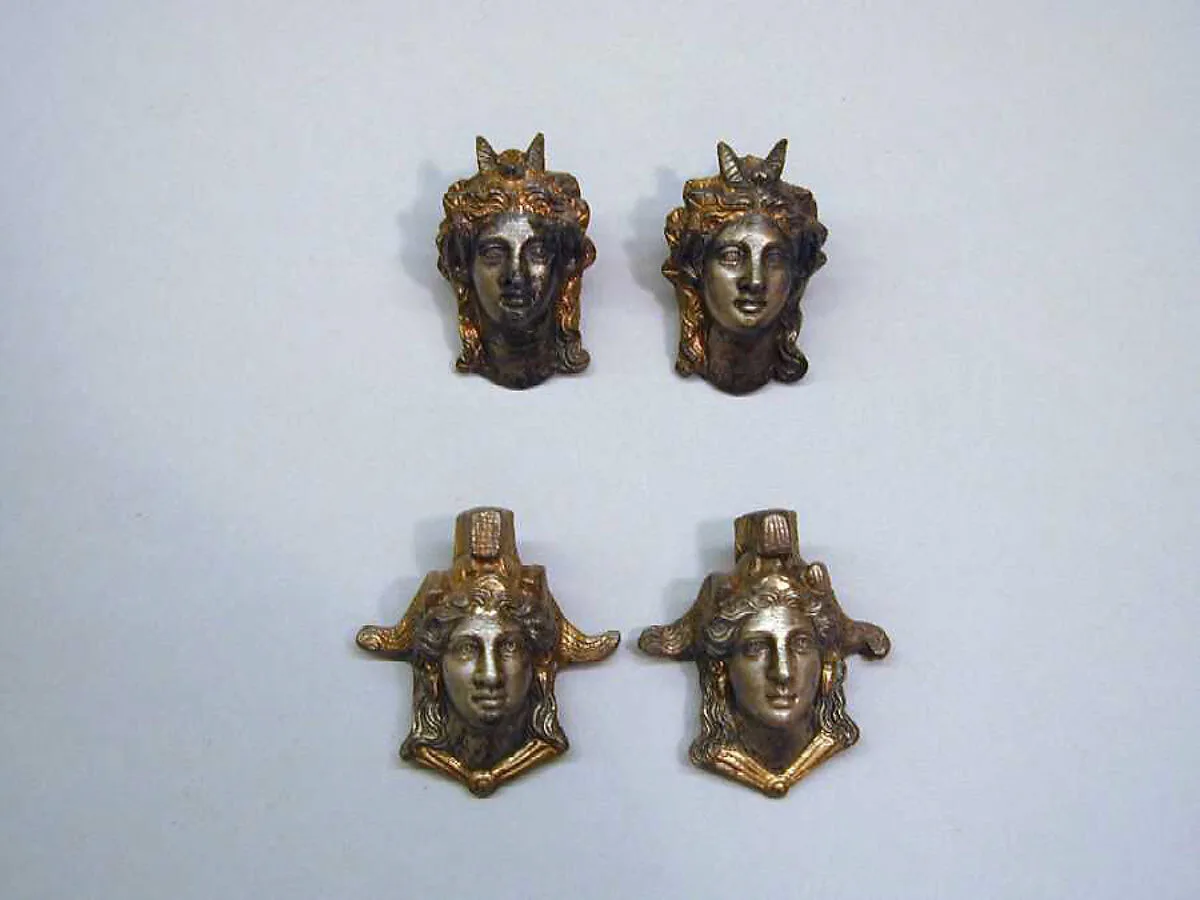 Four silver-gilt attachments — Unknown