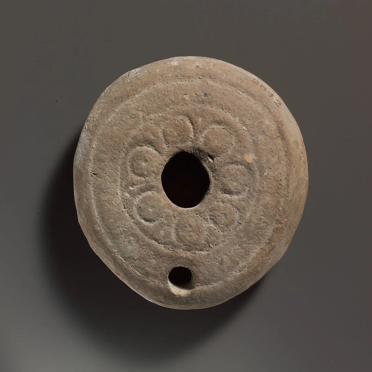 Terracotta oil lamp — Unknown