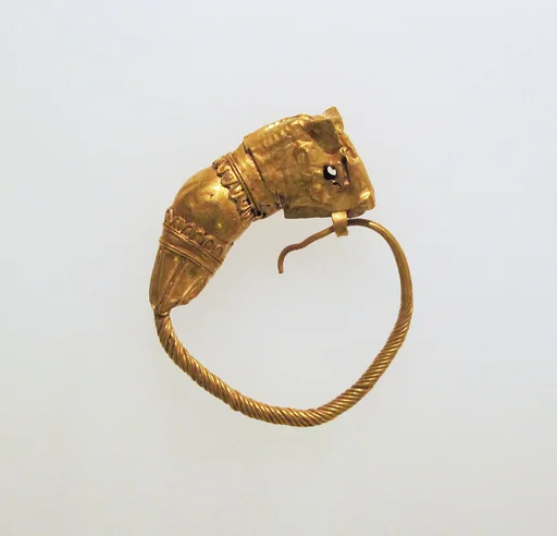 Gold earring with head of a bull
