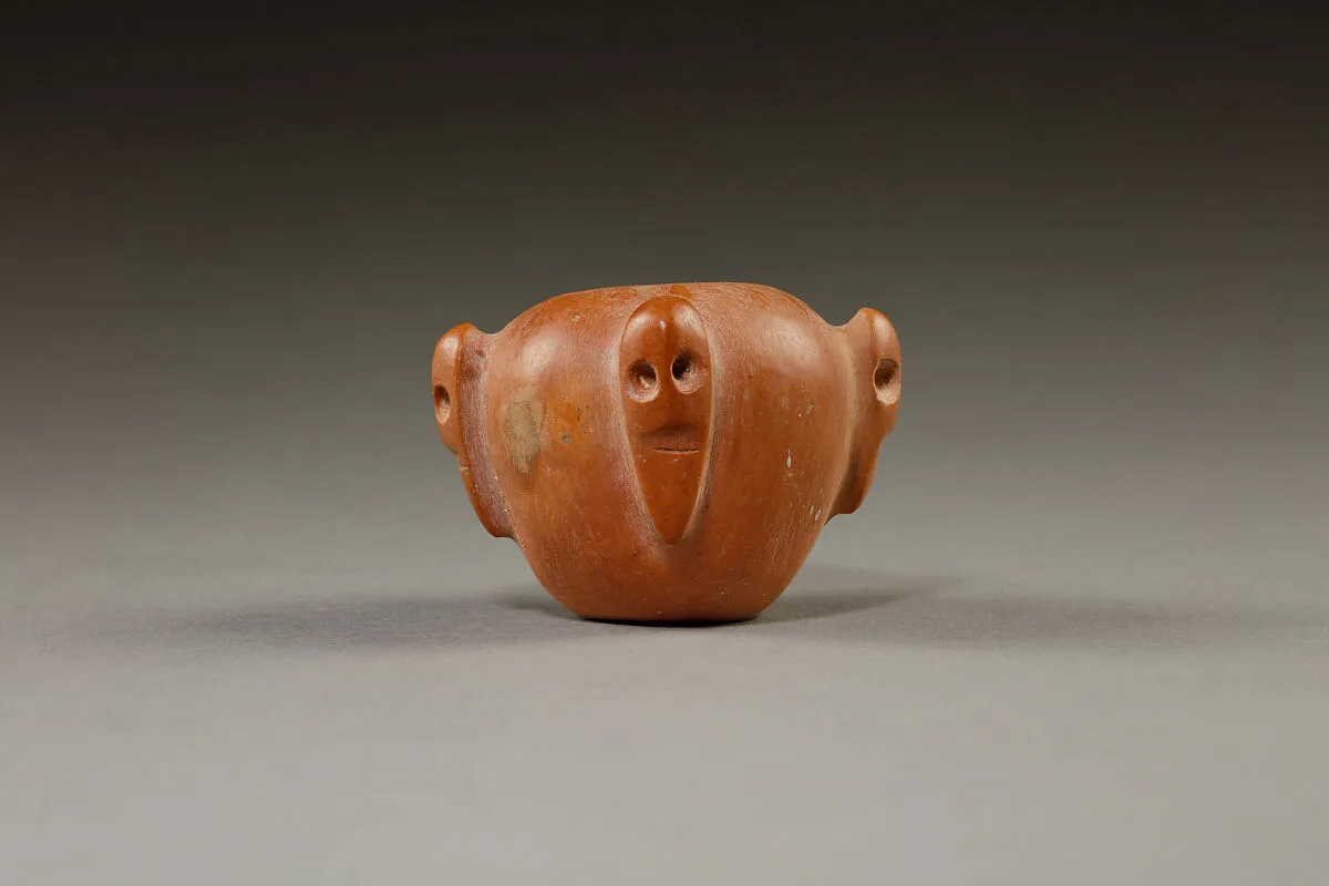 Piriform macehead with male faces — Unknown