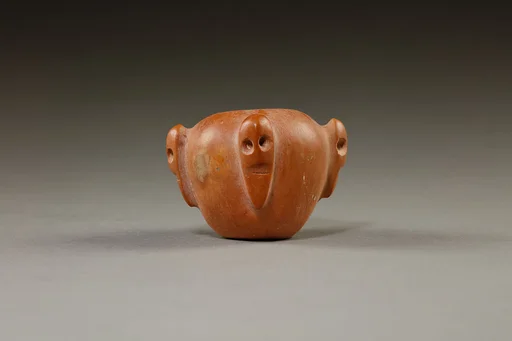Piriform macehead with male faces