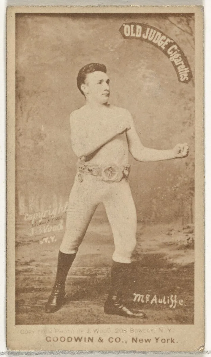 McAuliffe, from the Celebrities and Prizefighters series (N174) for Old Judge Cigarettes — Goodwin & Company|J. Wood