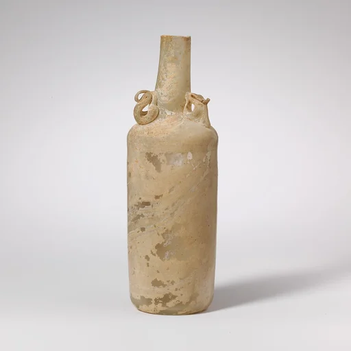 Glass bottle with dolphin handles