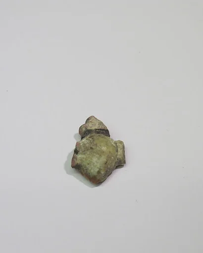 Mold-pressed amulet or fragment