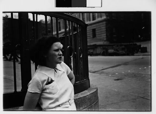 [Two 35mm Film Frames: Woman Standing on Street]