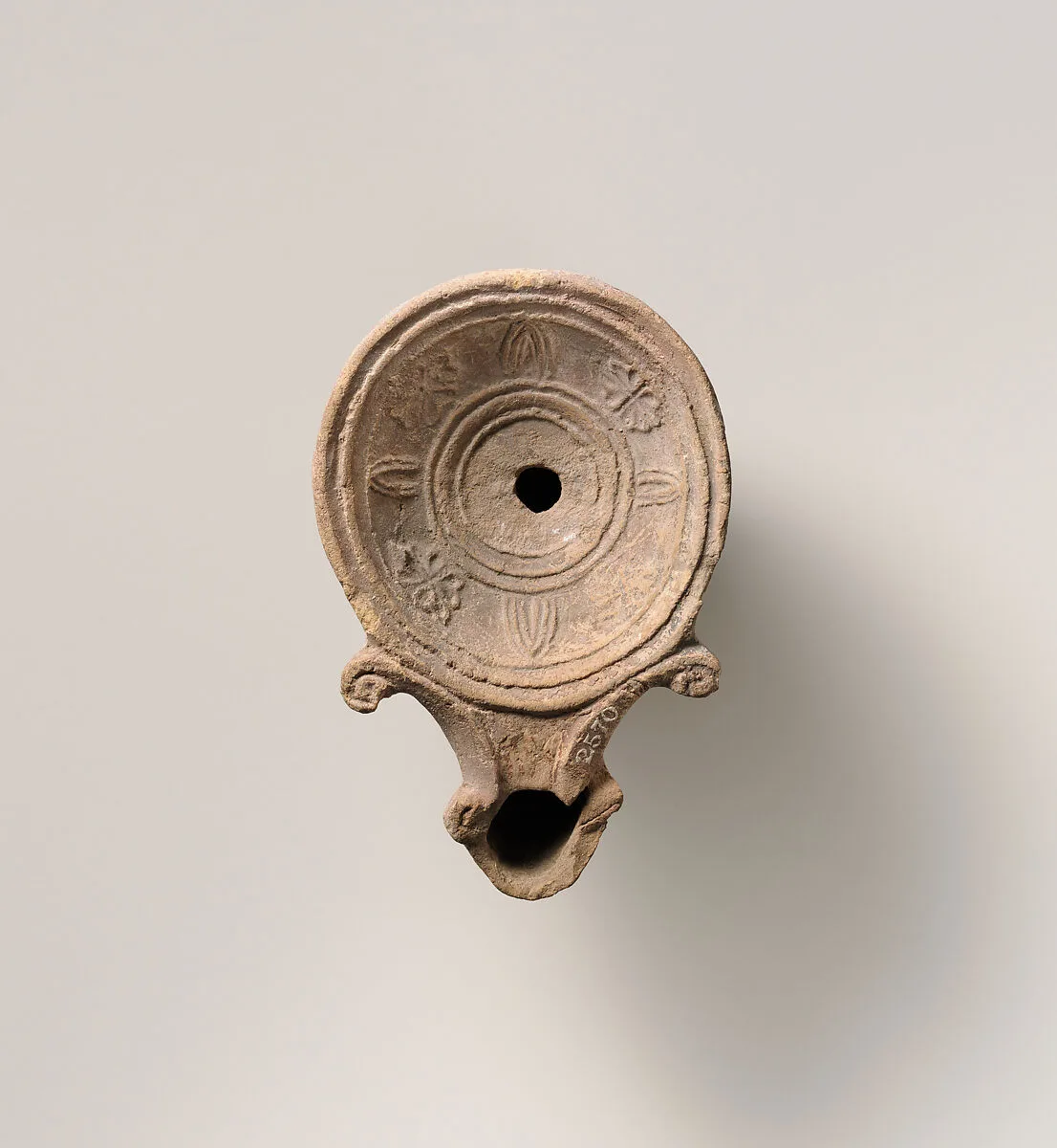 Terracotta oil lamp — Unknown