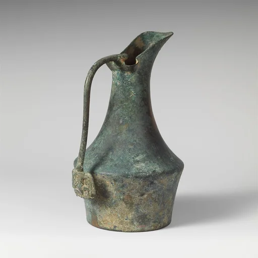Bronze jug with handle attachment showing running youth