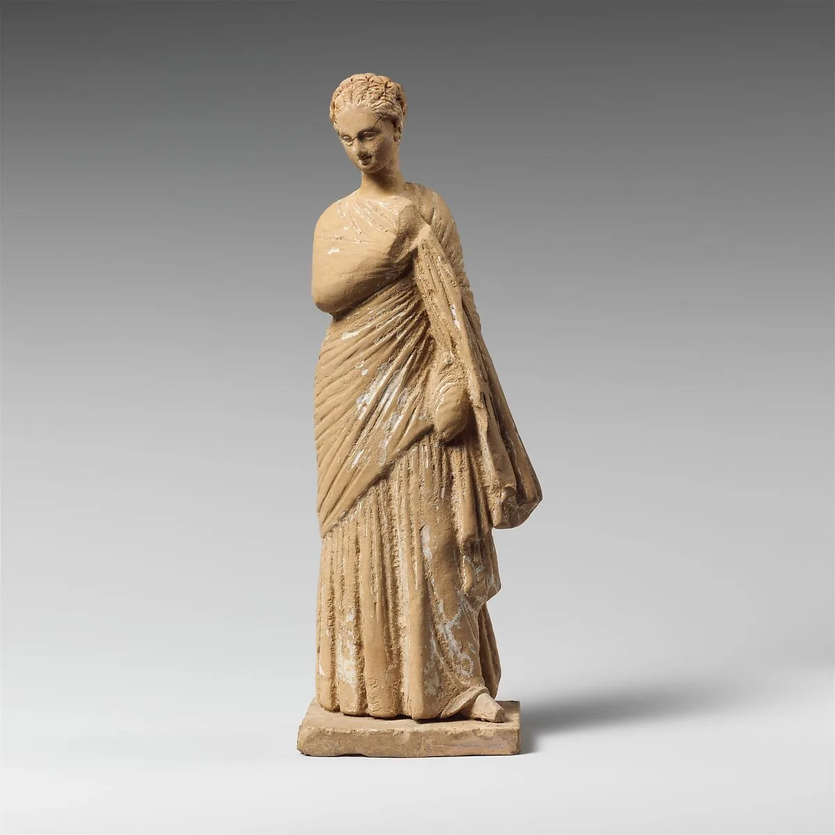 Terracotta statuette of a draped woman — Unknown