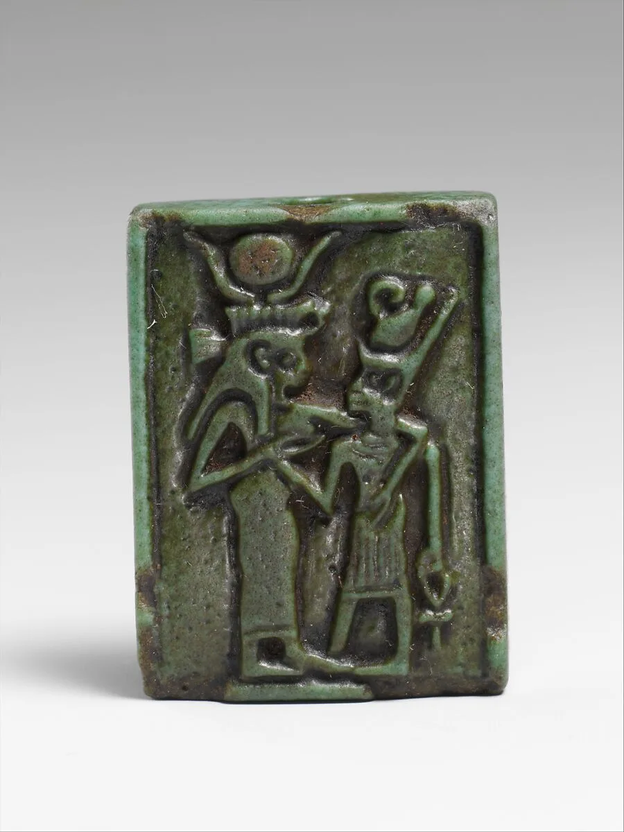 Faience amulet plaque of Isis nourishing a pharaoh — Unknown