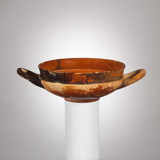 Terracotta stemless kylix (drinking cup)