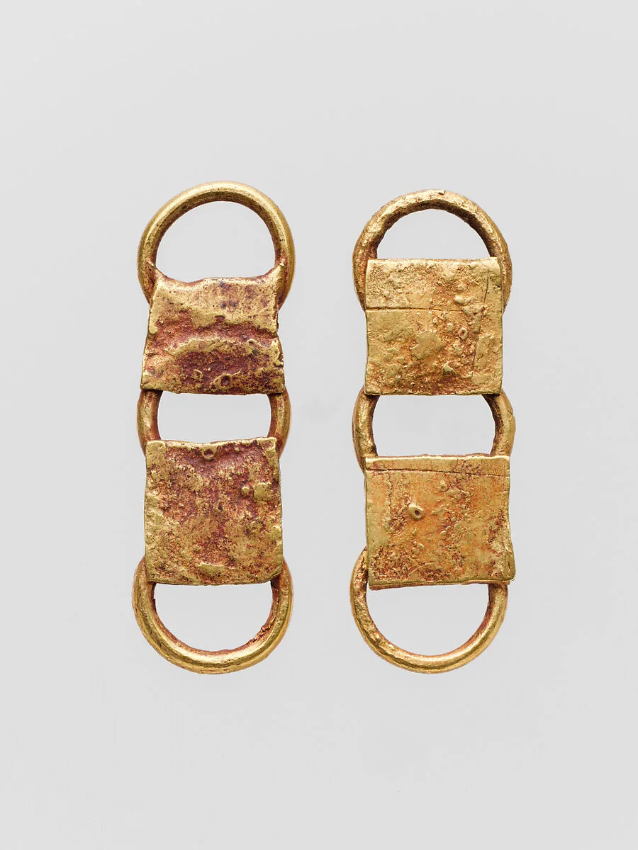 Two gold belt attachments — Unknown