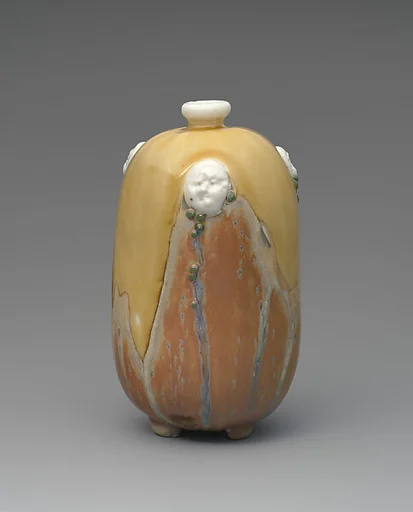 Vase with masks