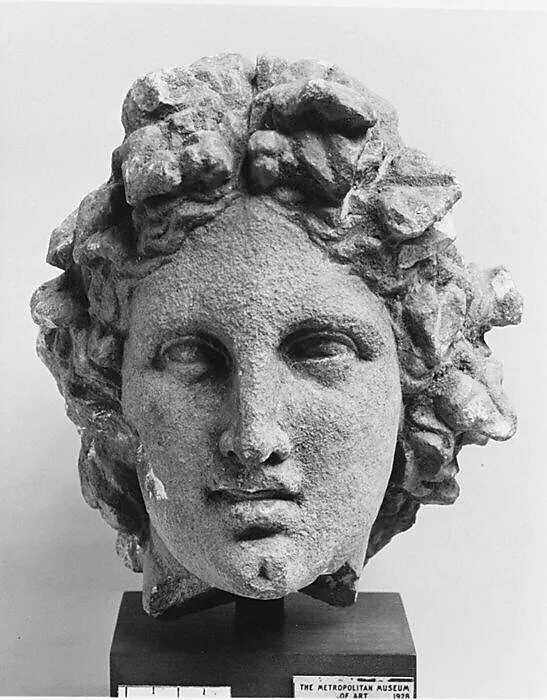 Limestone head of a wreathed youth — Unknown