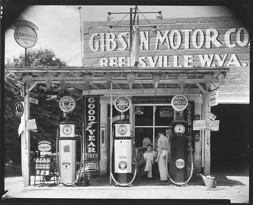 [Gibson Motor Company Gas Station with Group of Men on Bench, Reedsville, West Virginia]