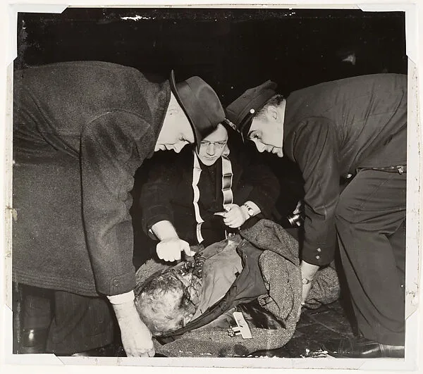 Tramp on Lower East Side Receiving the Last Rites — Weegee