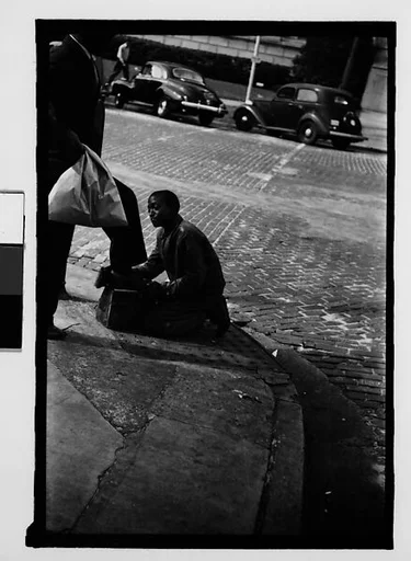 [Five 35mm Film Frames on Uncut Roll of Boy Shining Shoes on Street Corner and Men Outside Shoe Store, Tallahassee, Florida]
