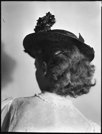 [Anne Harvey Wearing Hat, From Behind]