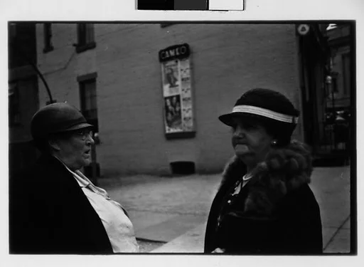 [Two 35mm Film Frames: Two Women in Conversation on Street, Ossining, New York]