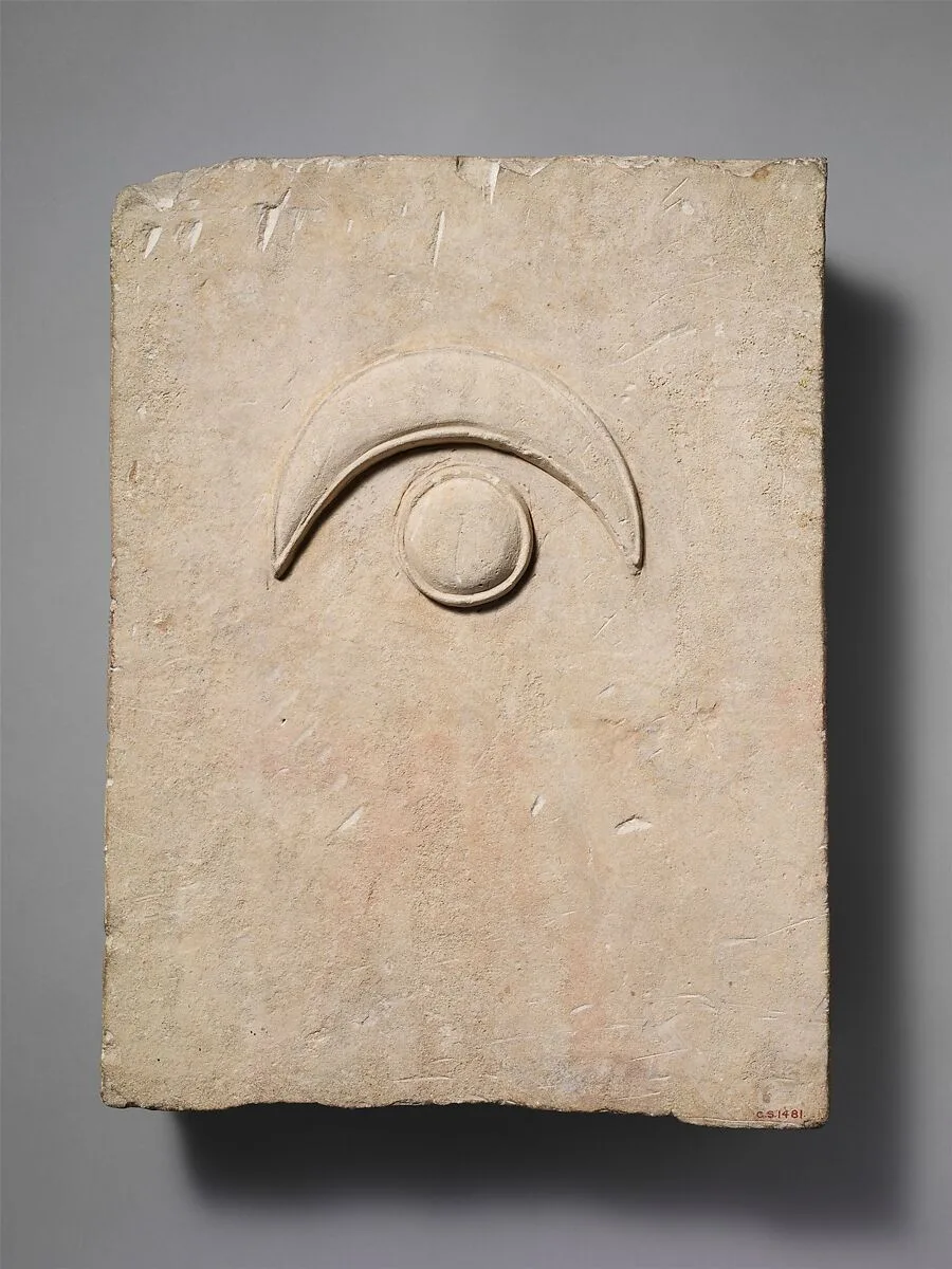 Fragment of a limestone funerary stele with a disk and a crescent — Unknown