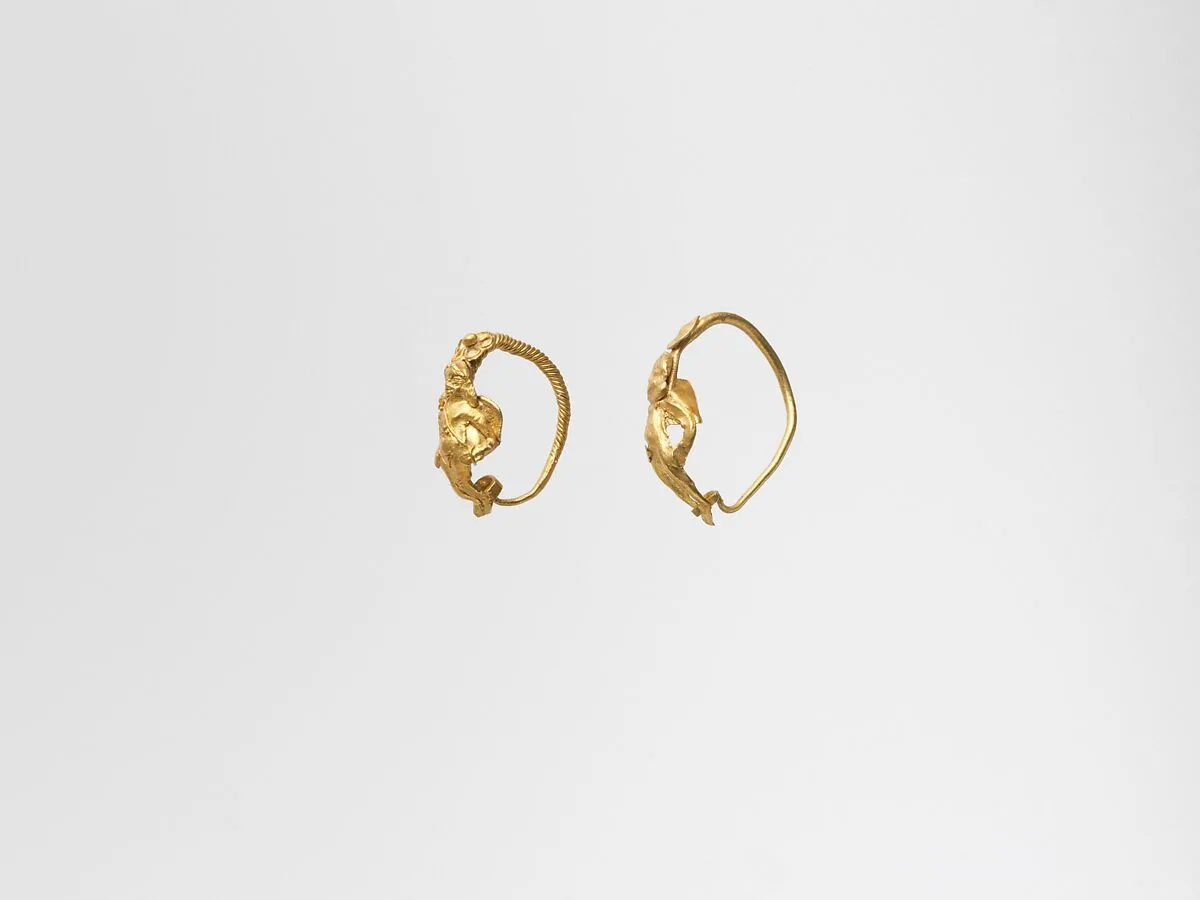 Gold earring with winged figure — Unknown