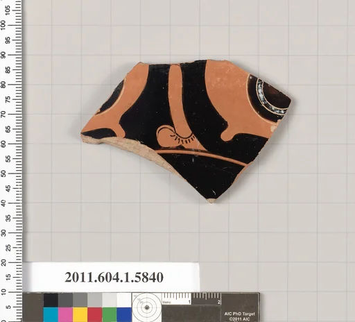 Terracotta fragment of a kylix: eye-cup (drinking cup)
