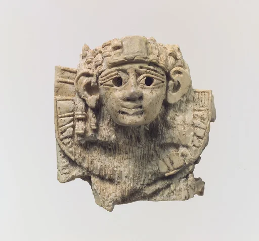 Openwork furniture plaque with head of a sphinx