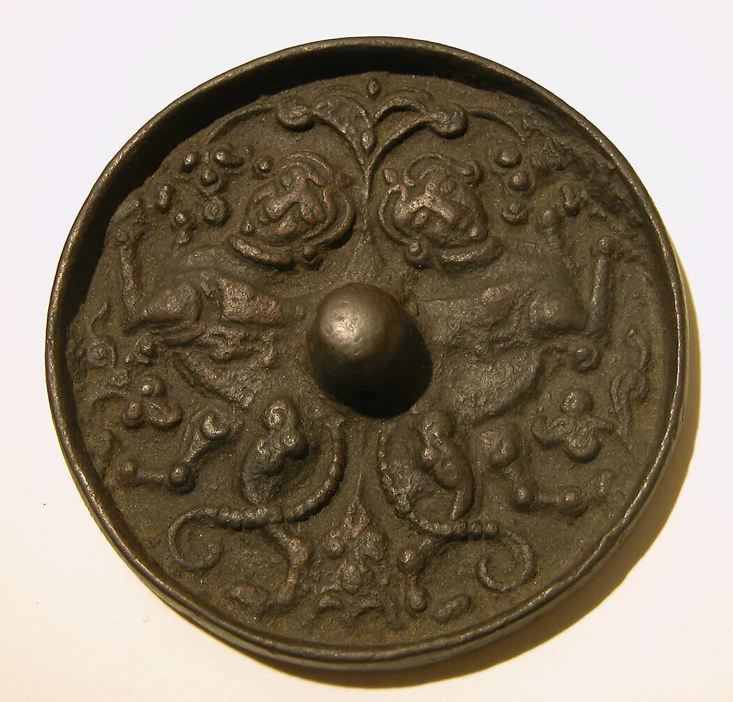 Mirror with a Pair of Addorsed Sphinxes with Scorpion Tails — Unknown