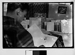 [Walker Evans Reading in Bateau Ivre Bookshop, Juan-les-Pins, France]