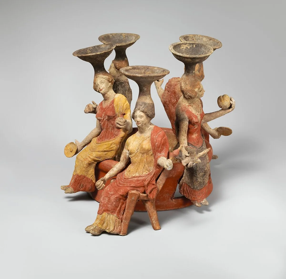 Terracotta group of women seated around a well head — Unknown