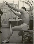 [Male Model Posed Pulling a Rope in Anna Huntington's Rooftop Studio]