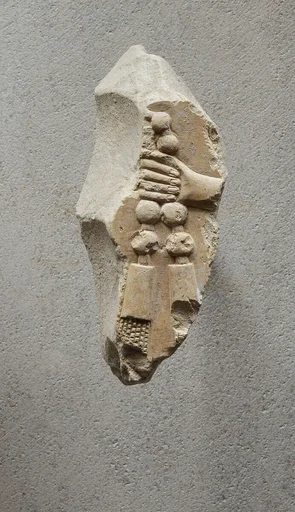 Relief of a hand with part of necklace - see 26.3.353-3