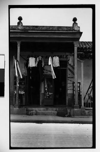 [Detail of Clothing Store Façade Under Colonnade, Havana]